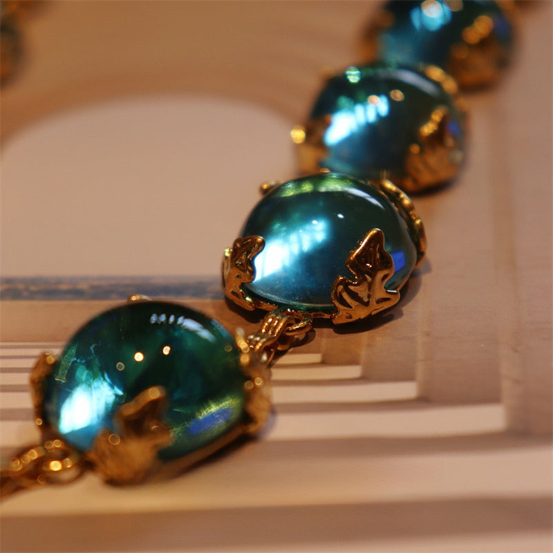 Lagunenlicht · Vintage-Halskette mit Teal-Glascabochon